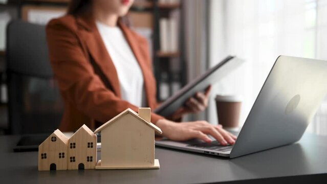 Considering buying a home, investing in real estate. Broker signs a sales agreement. agent, lease agreement, successful deal .
