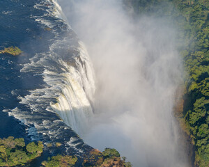Close-up view from a helicopter of the incredible Victoria Falls on the Zambezi River between...