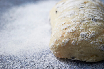 A loaf of bread on a vintage background - obrazy, fototapety, plakaty