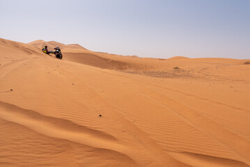 A motorbiker driving off-road in the Erg Chebbi desert became stuck in the sand