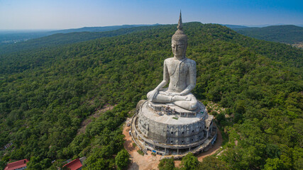 .aerial view Big white buddha statue on mountain for thai people travel visit and respect .praying at Wat Roi Phra Phutthabat Phu Manorom on May 15, 2017 in Mukdahan, Thailand. Kong river background..