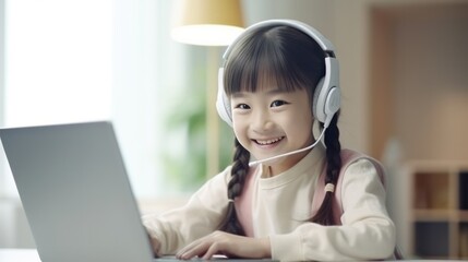 Asian little girl taking an online class on laptop. - obrazy, fototapety, plakaty