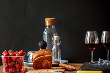 fresh strawberries and wine on table