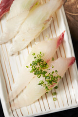 White fish sushi on a plate