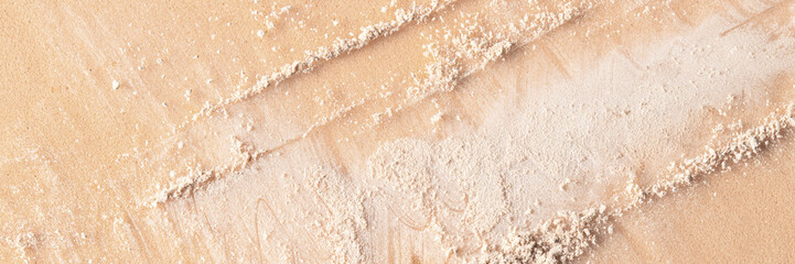 Close up of white beigecrushed powder textureon beige backgroudn for cosmetic banner backdrop