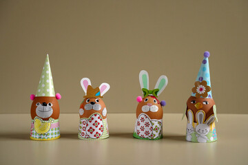 Easter egg figurines DIY. Easter rabbit figurine with colorful eggs. Easter eggs. Funny hares. toy rabbit. toy egg. Statuette easter bunny.