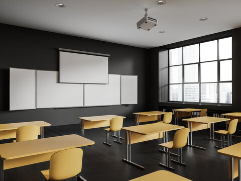 Modern class room interior with table in row and blackboard with screen, window