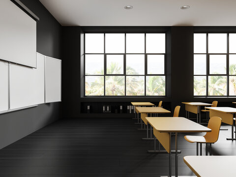 Gray classroom interior with projection screen