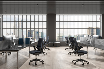 Stylish coworking interior with pc computer and armchairs in row, window