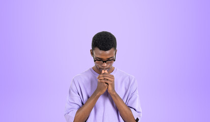Thoughtful African man college student, purple