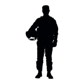 Air force pilot holding helmet standing full length silhouette.