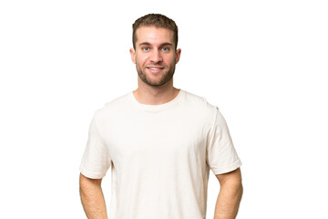 Young handsome caucasian man isolated on green chroma background laughing