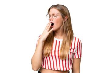 Young beautiful woman over isolated background yawning and covering wide open mouth with hand