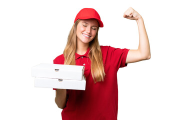 Young caucasian pizza delivery woman with work uniform picking up pizza boxes over isolated...