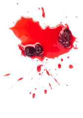 Fototapeta na wymiar Squashed ripe sour cherry in the puddle of red juice isolated on white