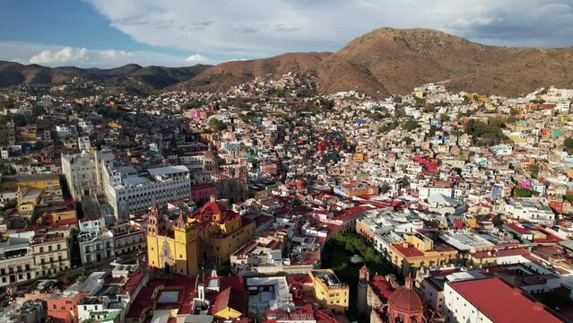 Drone footage flying over Guanajuato city houses and Monumento Al Pipila in Mexico