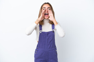 Young caucasian woman isolated on white background shouting and announcing something