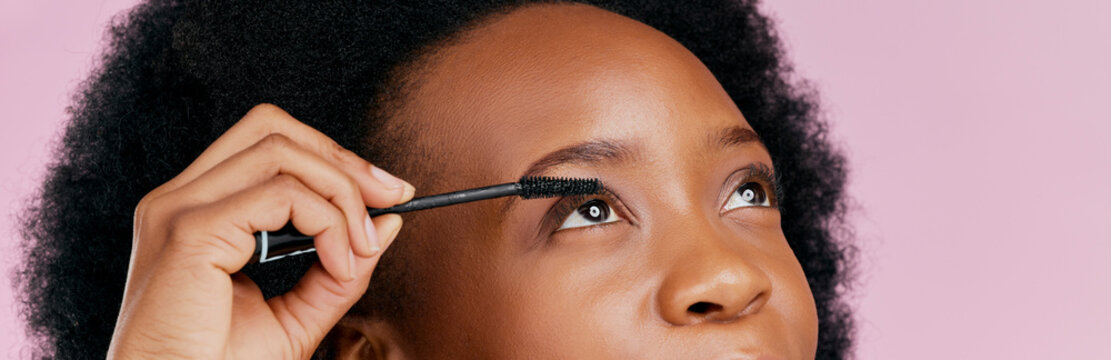 Eyes, Mascara And Brush, Makeup And Black Woman, Beauty And Cosmetic Product On Pink Background. Female Model, Hand And Eyelash Extension, Cosmetology And Lashes Transformation With Glow In Studio