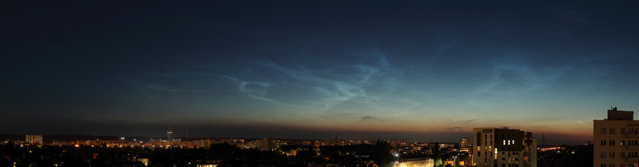 High resolution night panorama of Gdansk, Poland with noctilucent clouds (NLC) shining in the sky.