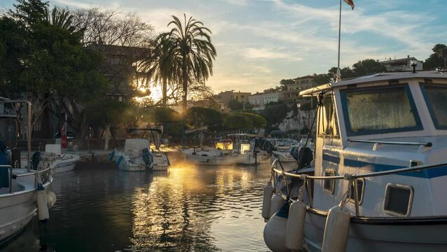 Time-lapse shot on a foggy Sunrise in the marina of Porto Cristo