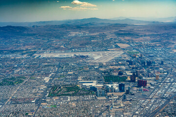aerial landscape view of Las Vegas area with famous buildings along the Las Vegas Blvd (Las Vegas Strip) and main Airport (KLAS, LAS)  