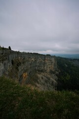Fototapeta premium View of Creux du Van on a cloudy day. Swiss canton of Neuchatel, Switzerland.