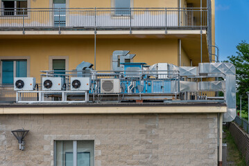 Air conditioning units (HVAC) with compressors installed outside the building