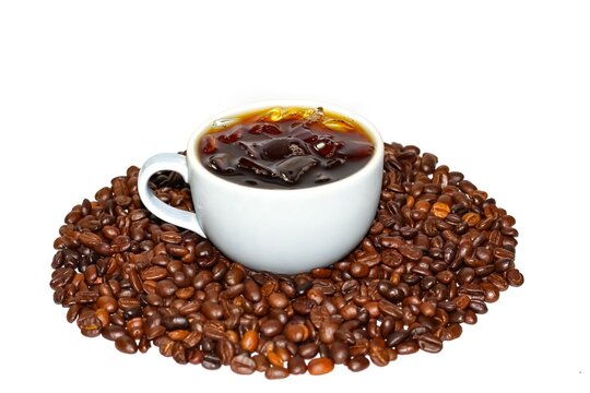 Americano ice coffee put on center of the coffee beans in concept isolated picture.Americano ice coffee for releasing time..