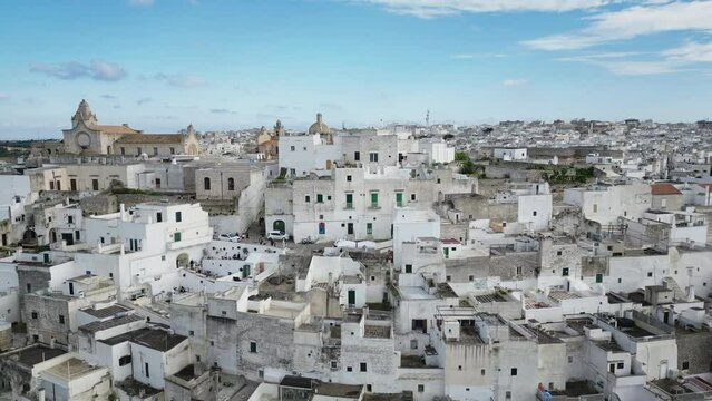 Aerial of the white buildings of Brindisi city in Italy under the blue sky