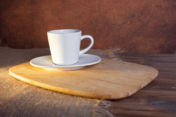 Black coffee cup on an old wooden table side view