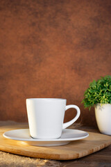 Black coffee cup on an old wooden table side view