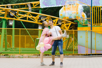 Couple in love is having fun at an amusement park