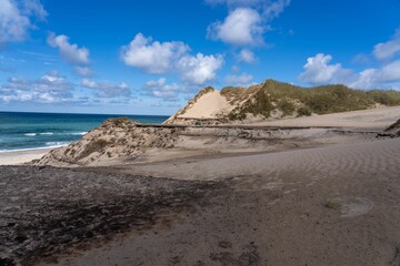 Obraz na płótnie Canvas Scenic view of a sandy beach with the crystal-clear sea in Nationalpark Thy in Denmark.