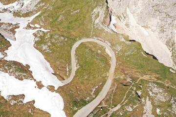 two road snakes are seen in the middle of a snowy mountain