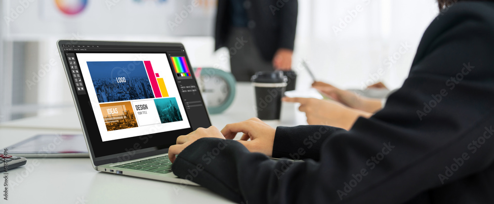 Poster graphic designer software for modern design of web page and commercial ads showing on the computer s