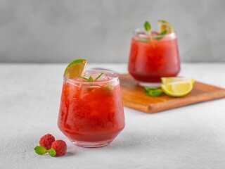 Closeup of two glasses of berry mojito