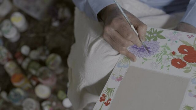 Closeup of a person painting beautiful flowers