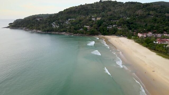 Drone Video High angle shots Kata Beach, Karon, beautiful beach in Phuket, Thailand, the perfect place to relax. For families on holidays, sunbathing, playing water activities.