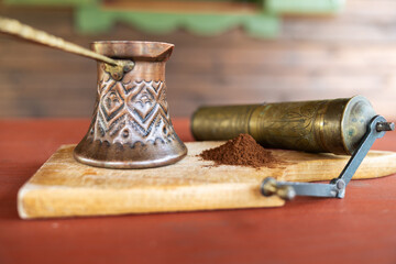 Vintage coffee pot and manual coffee grinder. Retro style of making natural espresso