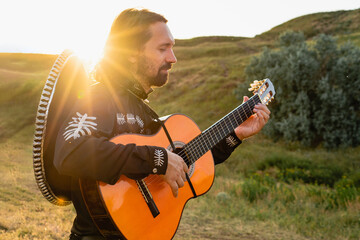 Mexican musicians mariachi with guitar.