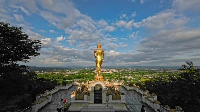 Tranquil Thailand. Clouds, Landmarks, and Buddha Statues in Time Lapse. Wat Phumin, Nan, Thailand
