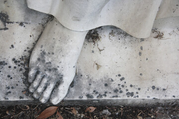 Foot of marble statue. Ancient sculpture detail, worn by time.

