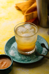 Summer cocktail with mango juice and ice