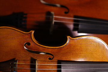 Fototapeta premium Cello's and violin's antique body closeup. String instruments.