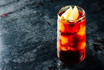 Fresh made coktail Cuba Libre with brown rum, cola and lemon