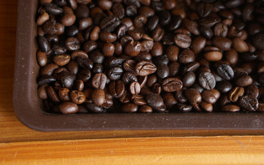 Indulge in the enticing aroma of aromatic coffee beans in the tray. Experience the rich and fresh...
