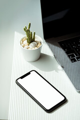 White blank screen smart phone mockup on the table