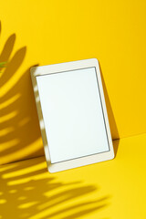 White screen digital tablet mockup on yellow background