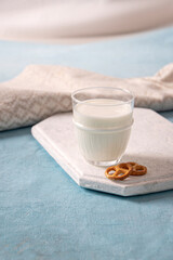 Glass of milk with cookies on the table