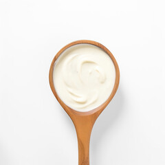 Bechamel Sauce (White Sauce) in a wooden spoon top view